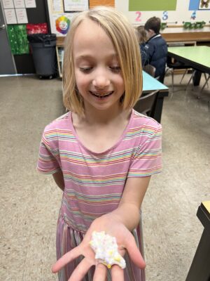 Student-holding-slime-made-in-art-class